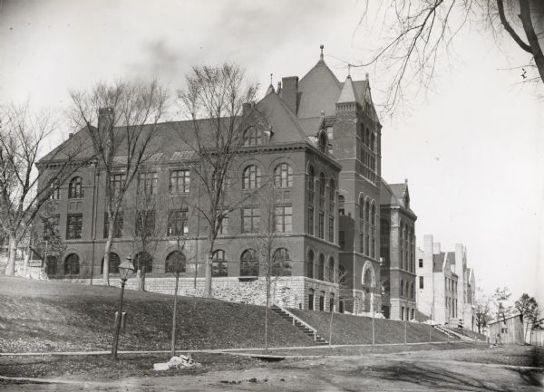 View across Park Street towards the northwest of the new Science Hall, shortly after its completion on the University of Wisconsin-Madison campus. Part of the Chemical Laboratory building is visible to the right behind Science Hall.