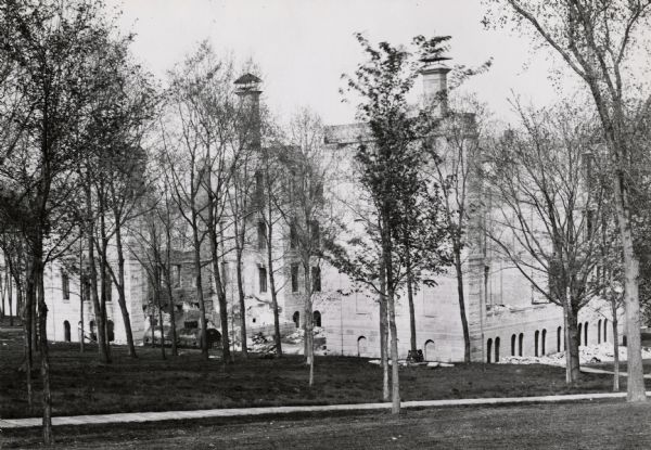 View down Bascom Hill of Science Hall (1876-1884) in the process of being demolished.