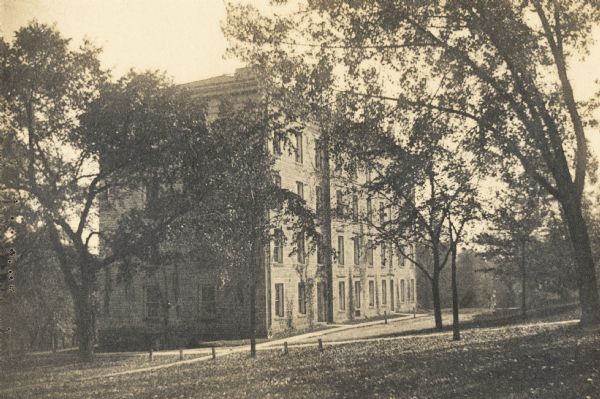 View looking south across Bascom Hill. Constructed between 1850-1855, South Hall was originally used as a dormitory for both faculty and students.