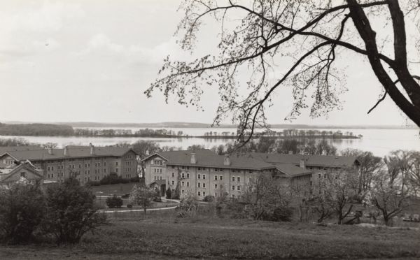 View from hill of Tripp Hall and Adams Hall on the University of Wisconsin-Madison campus. Lake Mendota and Picnic Point are in the background.