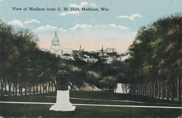 View from Bascom Hall on the University of Wisconsin-Madison campus. In the foreground is the Lincoln Monument on top of Bascom Hill, and the Wisconsin State Capitol is visible in the distance. Caption reads: "View of Madison from U.W. hall, Madison, Wis."