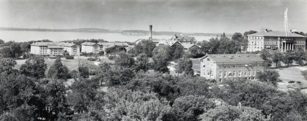 Elevated panoramic view towards the northeast from the tower of the Congregational Church of the University of Wisconsin-Madison campus, with Lake Mendota in the background.