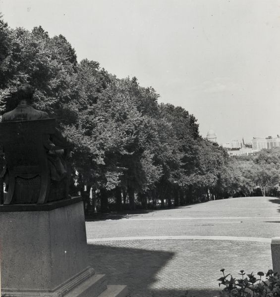 View down Bascom Hill on the University of Wisconsin-Madison campus. The Abraham Lincoln Monument is in the left foreground. The Wisconsin State Capitol is in the far background on the isthmus.