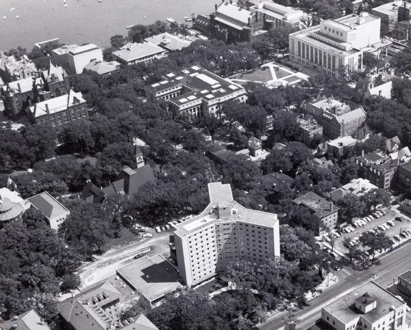 Aerial view over University Avenue of University of Wisconsin-Madison campus. Chadbourne Hall, built 1958-1959, is in the lower foreground, the Wisconsin Historical Society on Library Mall is in the middle, and Lake Mendota is in the top background.