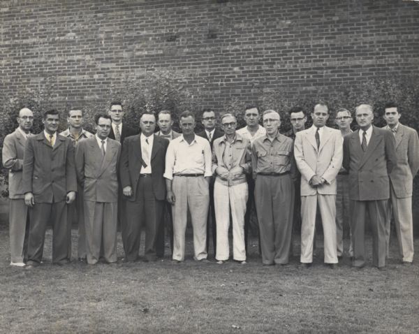Group picture of some employees of the Consoweld Company (formerly the Plastics Division of Consolidated Paper): Front row, left to right: John O'Leary, Toggy Saunders, Maynard Vendehey, Ralph Turner, Larry Crunelle, Joe Nash, Jay Somers, Syd Chiswell; Back row, left to right: Ralph Boyer, Harold Arnett, Jim Gilbert, Bob Hanson, Morris Nystrum, John Ostrawski, Bill Smalley, Bill Barrett, and Gib Endrizzi. Somers was the vice-president and general manager of the company.