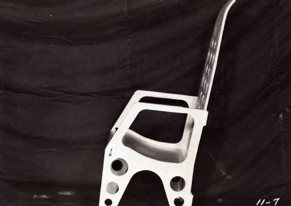 Lightweight folding transport chair produced by the Plastics Division of Consolidated Paper Company, Wisconsin Rapids, as part of the company's war development work.