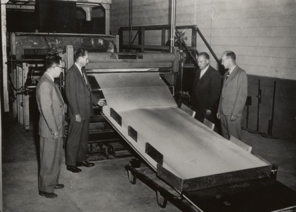 Officials of the Consoweld Company (formerly the Plastics Division of Consolidated Paper Company) make a final inspection of the equipment in the new plastic laminate plant.  They are M.G. Saunders, Engineering supervisor, Jay G. Somers, General Manager; J.S. Criswell, production superintendent; and R.V. Boyer, Technical superintendent. Consoweld was sold in 1985.