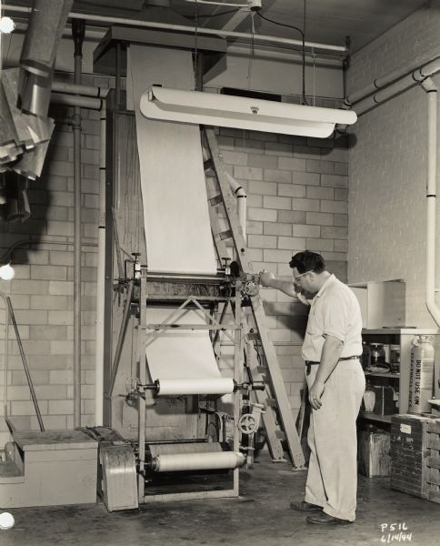 Laboratory development of a paper-based plastic laminate product by the Plastics Division of Consolidated Paper, during World War II. The product was used in gliders and other military equipment during World War II.