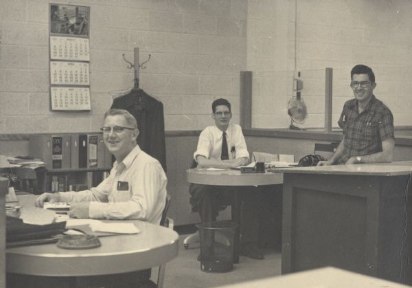 Consoweld Company employees shortly after moving into the new company building. It is likely the desk tops are made from a Consoweld plastic laminate product. Consoweld was a subsidiary of Consolidated Papers, Inc., of Wisconsin Rapids.