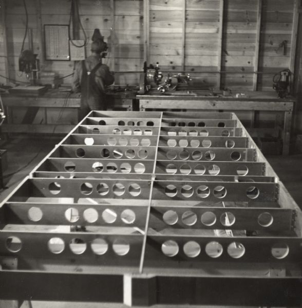 Floor for a military glider constructed of a paper-based plastic laminate by the Plastics Division of Consolidated Papers of Wisconsin Rapids.  This photograph is thought to document the development of the prototype.