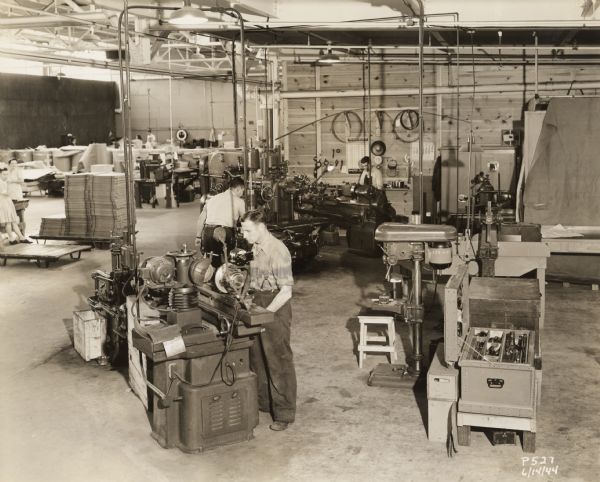 View of the floor of a Consolidated Papers Company factory, probably its Plastics Division in Wisconsin Rapids.