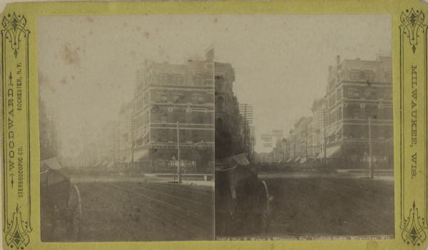Stereograph of Wisconsin Street looking south from the corner of East Water Street.