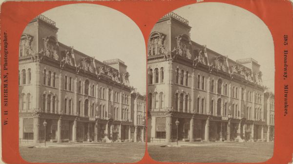 Stereograph view of Wisconsin Street in the 100 block; the Birchard Furniture store on the corner was at 121 and 123 Wisconsin Street. Text on the image reads 385 Broadway, Milwaukee.