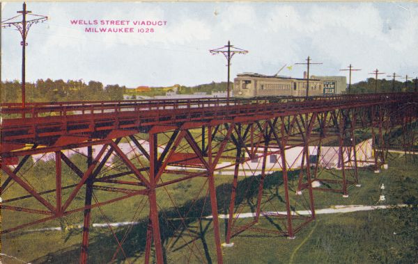 Elevated view of the Wells Street Viaduct. Caption reads: "Wells Street Viaduct, Milwaukee."