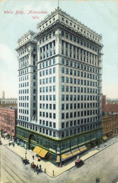 Elevated  view of the Wells Building on a street corner. Caption reads: "Wells Bldg, Milwaukee, Wis."