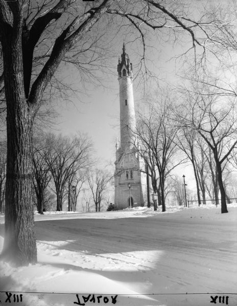 Water Tower Park with bare trees in the background. Snow covers the ground.