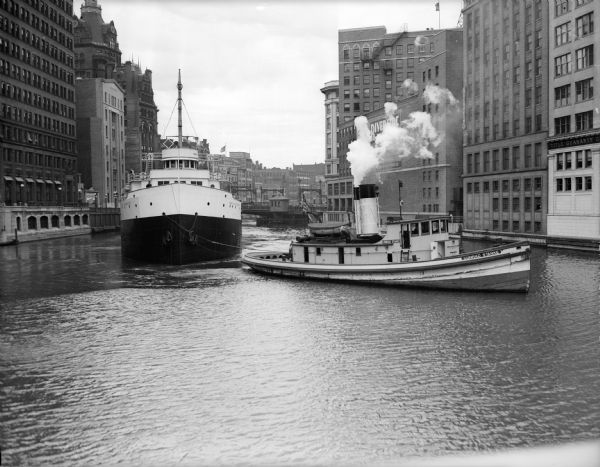 The "James E. McAlpine" in tow of tugboat "Conrad Starke" on the Milwaukee River.