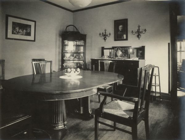 The dining room of the Richard Lloyd Jones residence, 1010 Walker Court (now 1010 Rutledge Court)showing the dining table, corner china cabinet and Arts and Crafts style buffet.