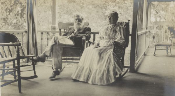 Rev. Jenkin Lloyd Jones and his wife Susan Lloyd Jones, probably on the porch of their cottage.  Susan died Oct 26, 1911 and Jenkin died Sept 12, 1918.