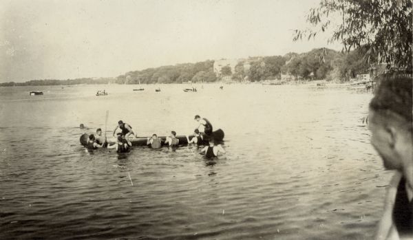 University of Wisconsin-Madison students play on a canoe in Lake Mendota near the campus.