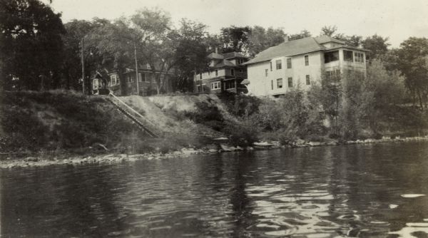 A view of three houses along Walker Court, Marquette neighborhood, taken from Lake Monona.  Left to Right: 617 S. Brearly, 1010 Walker Court, the Jones family home; and 1005 - 1007 Walker Court.