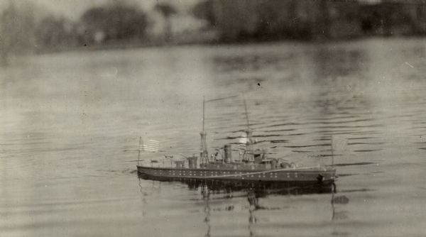 Toy battleship "Pennsylvania" floating on Lake Monona.