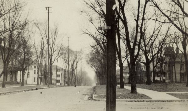 A view looking east on the 1000 block of Spaight Street with the Snell house, 1014 Spaight Street, on the left and the Gill house, 1021 Spaight Street, on the right.  Beyond the Gill house are the Ford house, 1033 Spaight Street, and the Coombs house, 1035 Spaight Street, designed by architects Claude and Starck.
