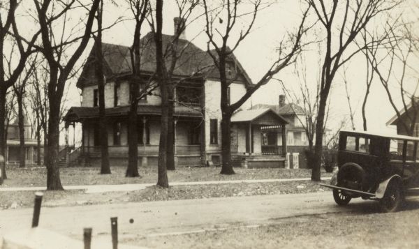 Rev. William Walker house (built 1886 and now demolished), 1007 Spaight Street at South Brearly, Marquette neightobhood.  There is an automobile in the foreground.