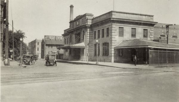 Chicago & North Western railroad station, 219 South Blair Street at East Wilson Street, built in 1910.  The Wisconsin Wagon Company, 115 South Blair Street, is visable beyond the Chicago & North Western freight depot, 201 South Blair Street.