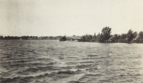 View across water towards the boathouse in Brittingham Park on Monona Bay, taken from the railroad causeway.