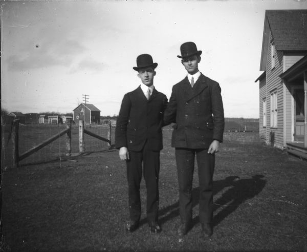 Richard (right) and Otto Lindner pose together, wearing derby hats.