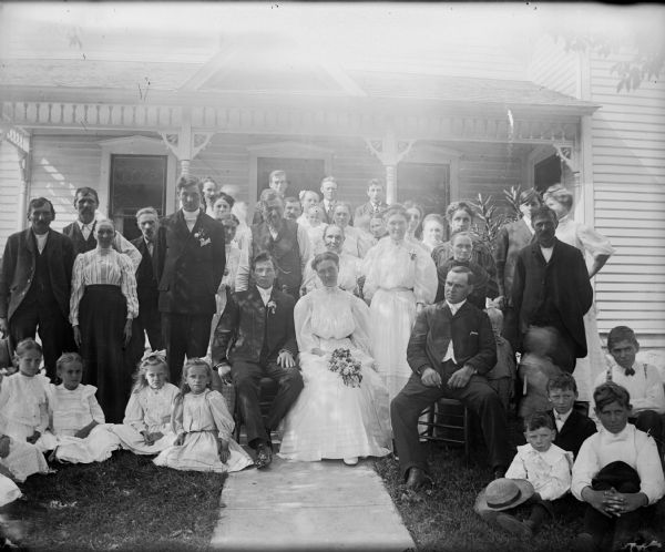 Wedding party posed in front of the Edward Lindner home.
