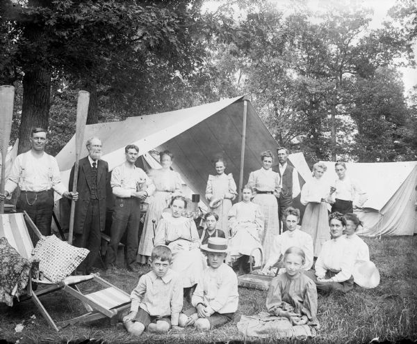 Group portrait during camping trip. Otto Lindner is holding the coffee pot.