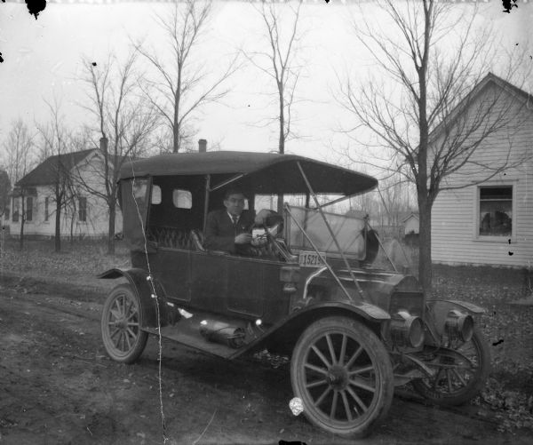 Ed Lindner at the wheel of a Model T Ford.