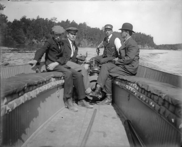 Four men boating in Wisconsin Dells.