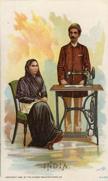 Chromolithograph card of an couple from India in "native" Indian costume, posing next to a Singer sewing machine. Part of a "Costumes of All Nations," set created as a souvenir at the 1893 World's Columbian Exposition.