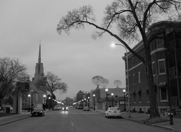 Scene of 6th Street at dusk. WKBT-TV's satellite dishes visible on right.