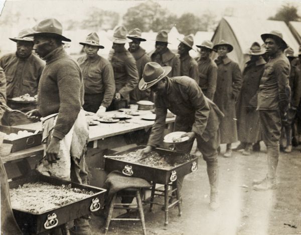 Chow line for members of the 15th Regiment (Colored) of the New York National Guard.