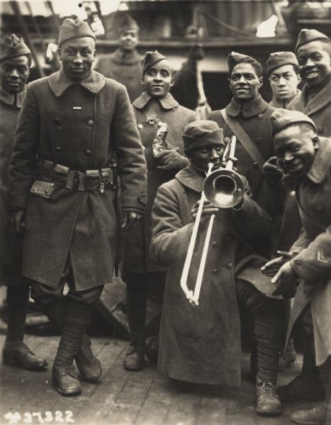 African American soldiers during World War I playing trombone music.