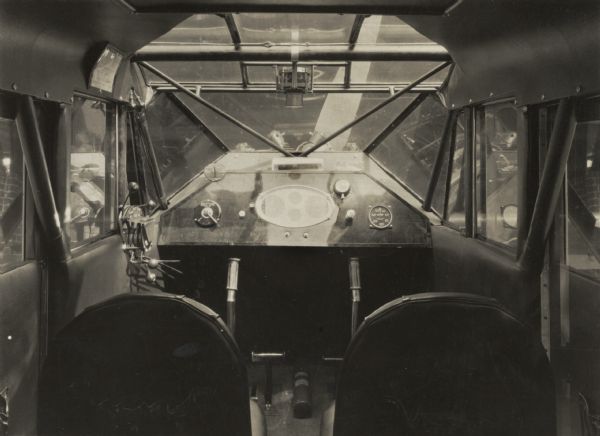 Interior view of a single engine airplane, probably a Monocoach 100K developed for racing.