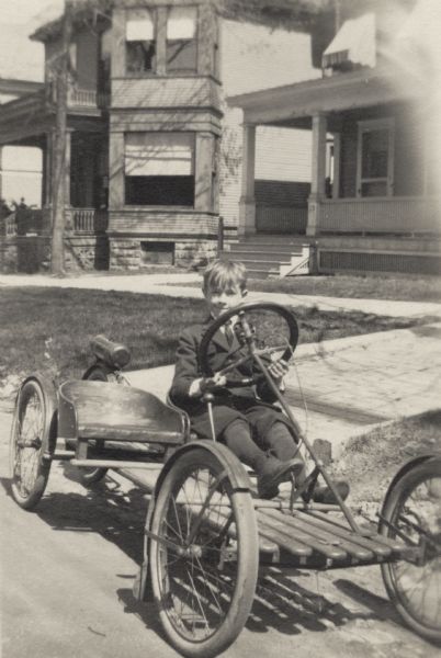 Reginald Jackson, Jr., of Madison, in his motorized two-seat toy car.