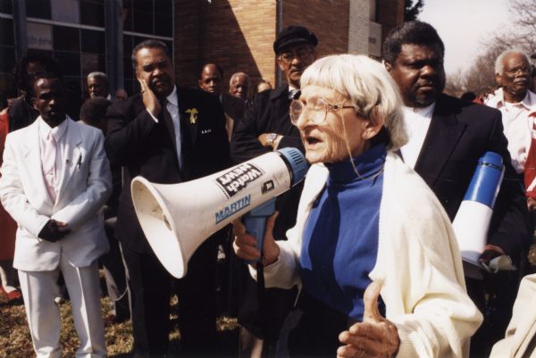 Civil rights activist Anne Braden speaking to a rally. Behind her is the Rev. Louis Coleman, also a local activist.