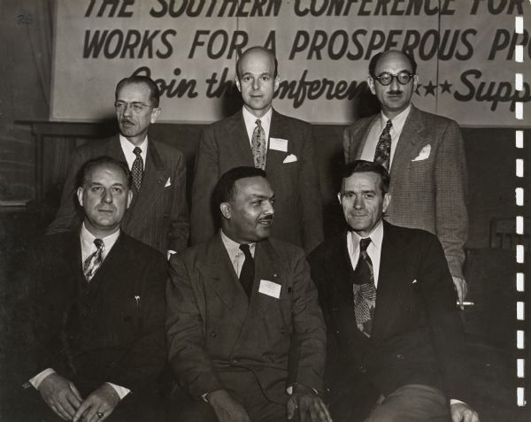 Aubrey Williams (seated at right), who would become president of the Southern Conference Education Fund (SCEF) at the annual convention of the Southern Conference for Human Welfare.  Williams was part of a session on the Southern economy that included (first row) Frank Prohl, Teamsters Southern Conference, and Lewis Jones, editor of Informer Publications.  Back row: Edward Stone, CIO publicist, Alfred Leiserson, paper manufacturer and head of the SCHW Virginia committee; and A.G Mezerik, economic consultant.