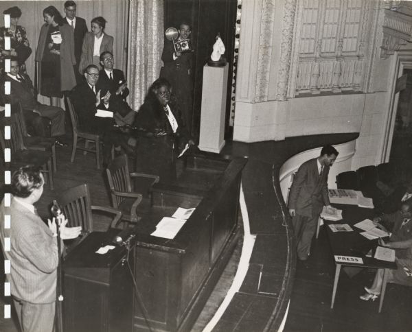 Mary McLeod Bethune, noted civil rights leader and educator, is introduced to the audience at the annual convention of the Southern Conference for Human Rights.  Senator Claude Pepper, the keynote speaker, is seated behind her.