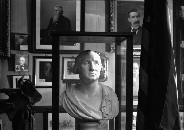 A bust of George Washington in the Grand Army of the Republic Civil War memorial hall on the top floor of the Wisconsin State Capitol. This photograph was taken before the rearrangement and modernization of the space.