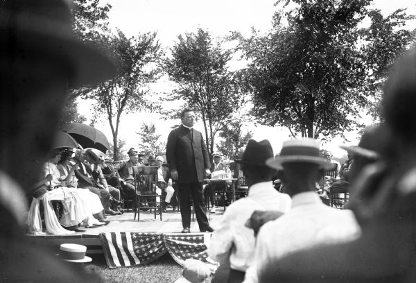 Marquette University dean, Archibald J. Tallmadge, S.J. delivers a speech at the 250th anniversary celebration of the discovery of the Mississippi River by Marquette and Jolliet.