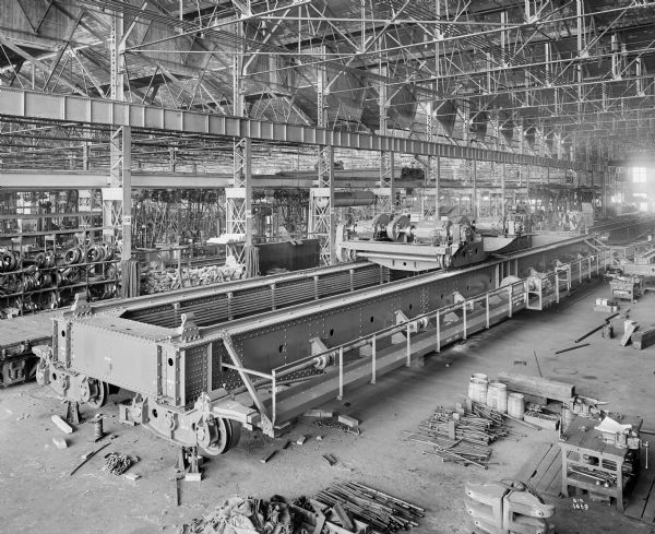 Elevated view of Pawling & Harnischfeger 7.5 ton type "N" bridge with a 15-ton type "A" trolley being assembled on the P&H assembly floor. The crane is stamped "Pawling & Harnischfeger Co., Milwaukee, Wis., Main Hoist 150,000 Lbs., Auxiliary 30,000 Lbs., No. 4414."