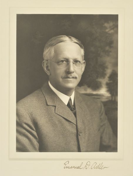 Quarter-length portrait in front of a painted backdrop of Emanuel A. Adler, Milwaukee manufacturer.
