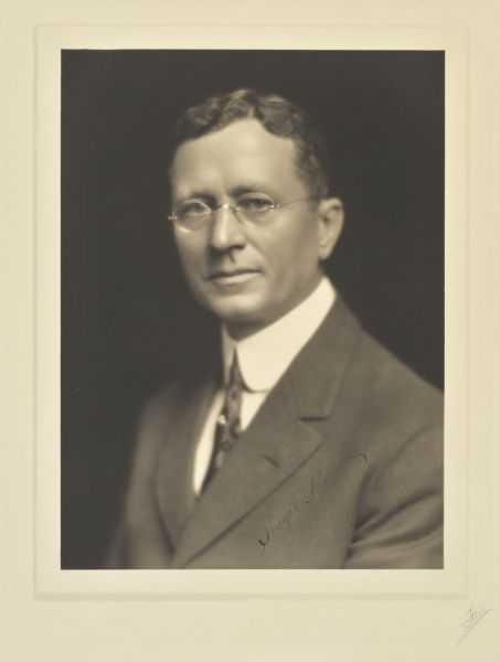 Quarter-length portrait of Hugh E. Bauch, Milwaukee merchant.