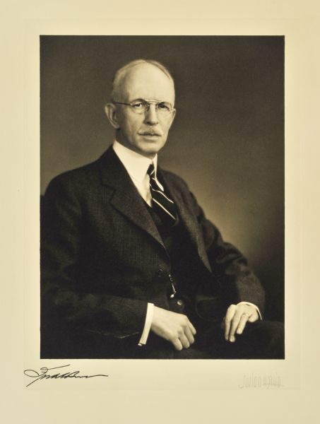Waist-up studio portrait of Fred C. Best, Milwaukee mortgage company president.
